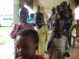 Children at Oji River leprosy compound enjoy lollipops